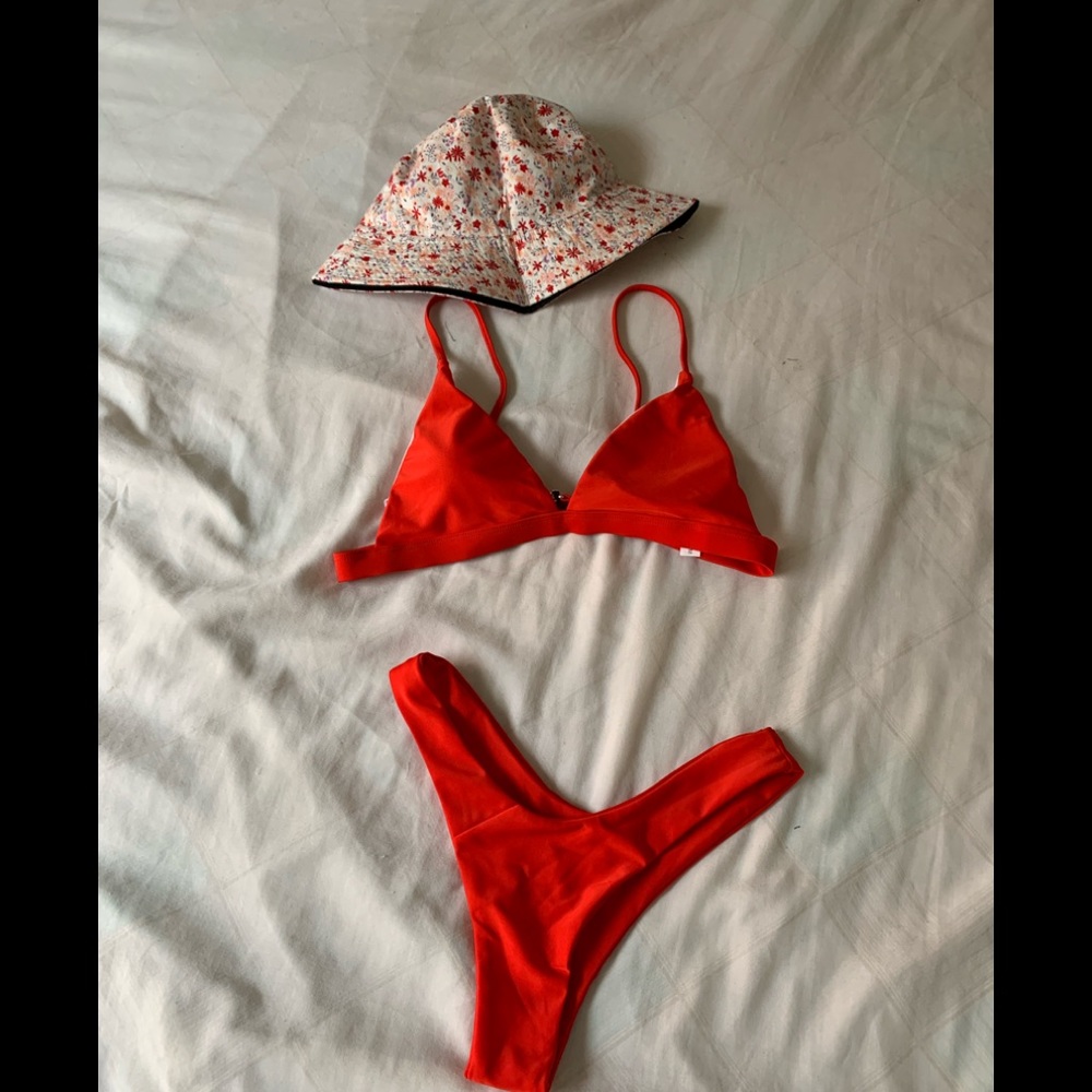 New red bathing suit with flowers hat